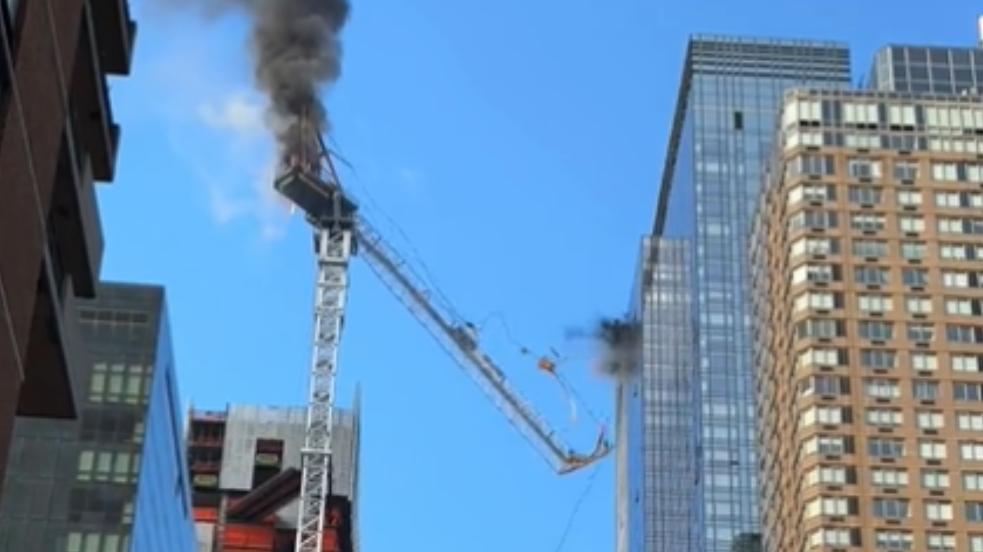 Crane Bursts Into Flames, Partially Collapses and Injures Two In Hell’s Kitchen, New York [VIDEO]